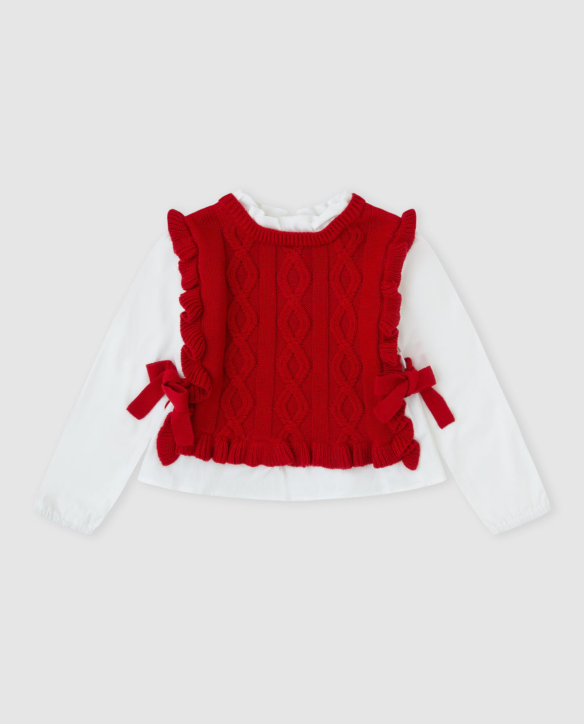 Tutto Piccolo rode gebreide meisjestrui voorkant - kabelpatroon met ruffle randen en rode strikjes, ingebouwde witte mouwen en ruffle kraag als 2-in-1 look